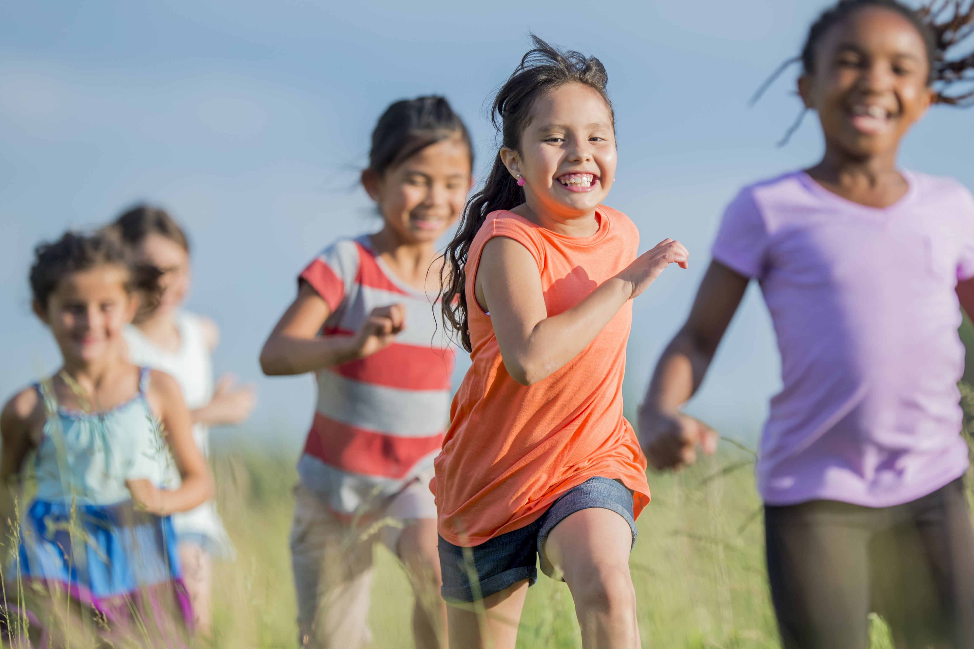 Children running in a field